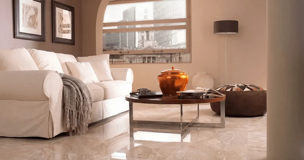 Modern living room with professionally installed marble flooring, a beige sofa, coffee table in Baltimore, MD